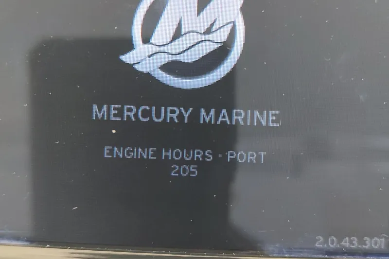 Never Enough Yacht Photos Pics Display showing Mercury Marine engine hours at 205 for Out Island SeaTek 36 Express, 2017 model.