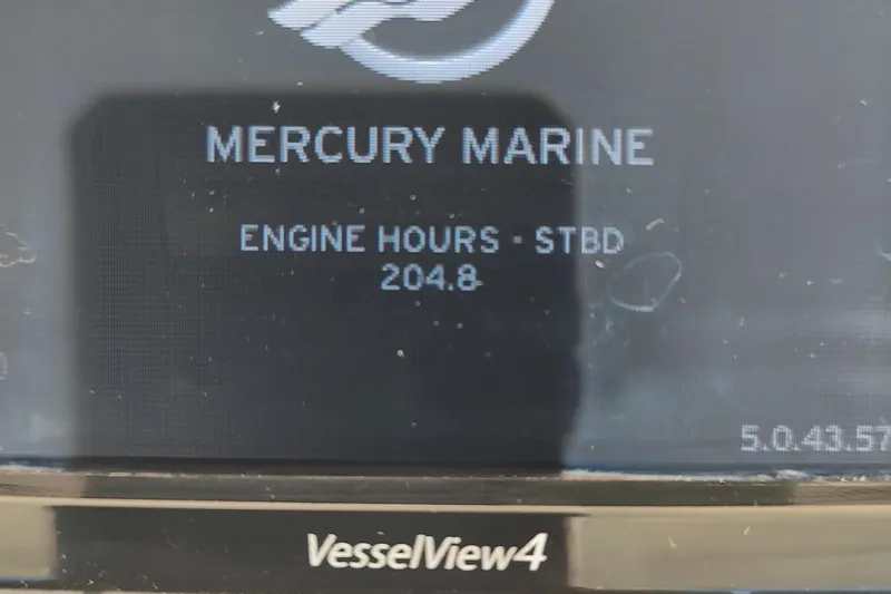 Never Enough Yacht Photos Pics Mercury Marine VesselView4 display showing 204.8 engine hours on Out Island SeaTek 36 Express.