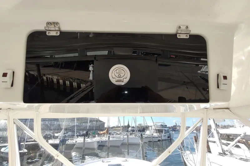 Never Enough Yacht Photos Pics 2017 Out Island SeaTek 36 Express boat interior with marina view.