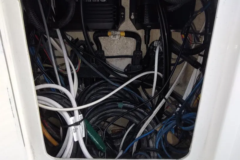 Never Enough Yacht Photos Pics Tangled wires and cables inside a 2017 Out Island SeaTek 36 Express boat.