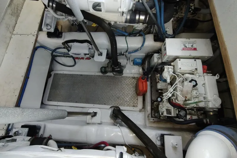 Never Enough Yacht Photos Pics Engine room of 2017 Out Island SeaTek 36 Express, showcasing mechanical components and layout.