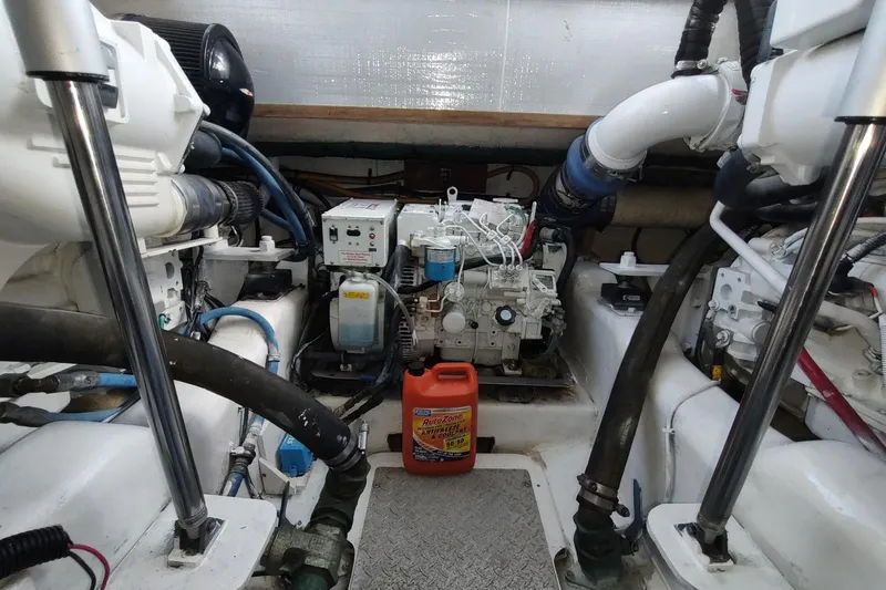 Never Enough Yacht Photos Pics Engine room of 2017 Out Island SeaTek 36 Express with visible machinery and equipment.