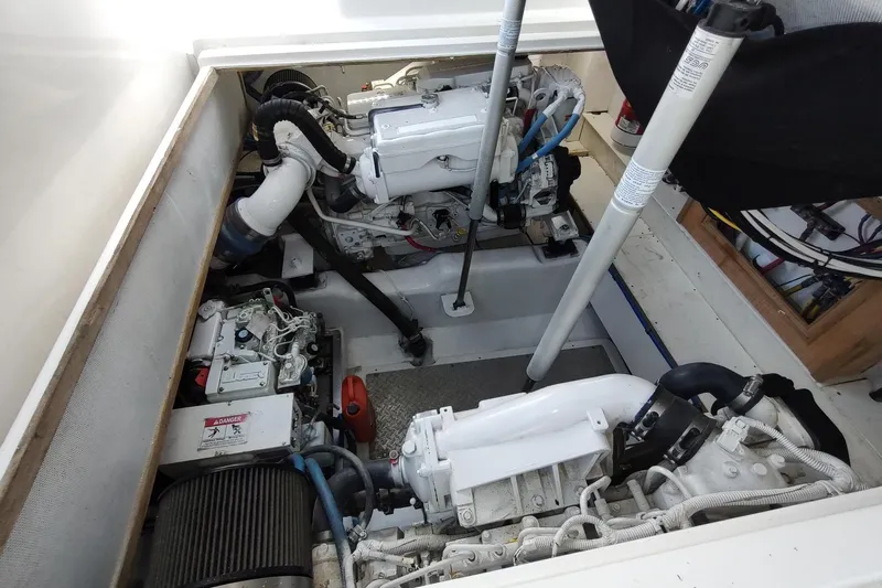 Never Enough Yacht Photos Pics Engine compartment of 2017 Out Island SeaTek 36 Express boat, showcasing dual engines.