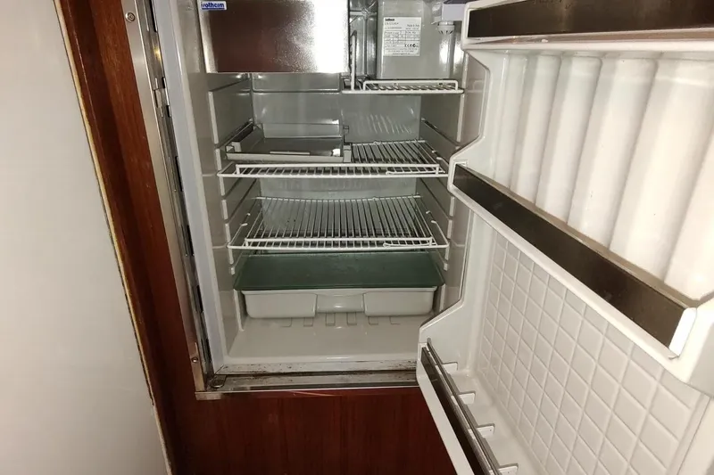 Never Enough Yacht Photos Pics Empty refrigerator inside 2017 Out Island SeaTek 36 Express boat.