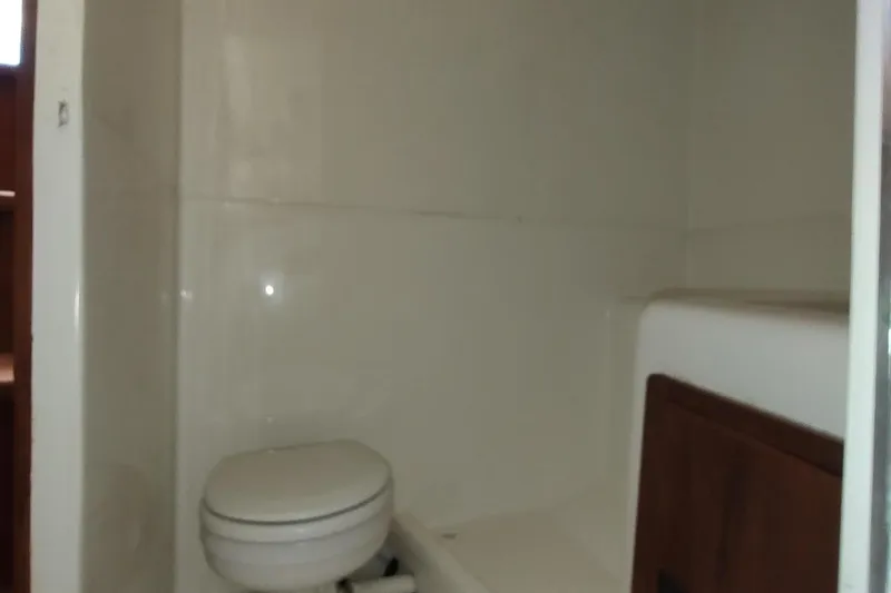 Never Enough Yacht Photos Pics Bathroom interior of 2017 Out Island SeaTek 36 Express boat.