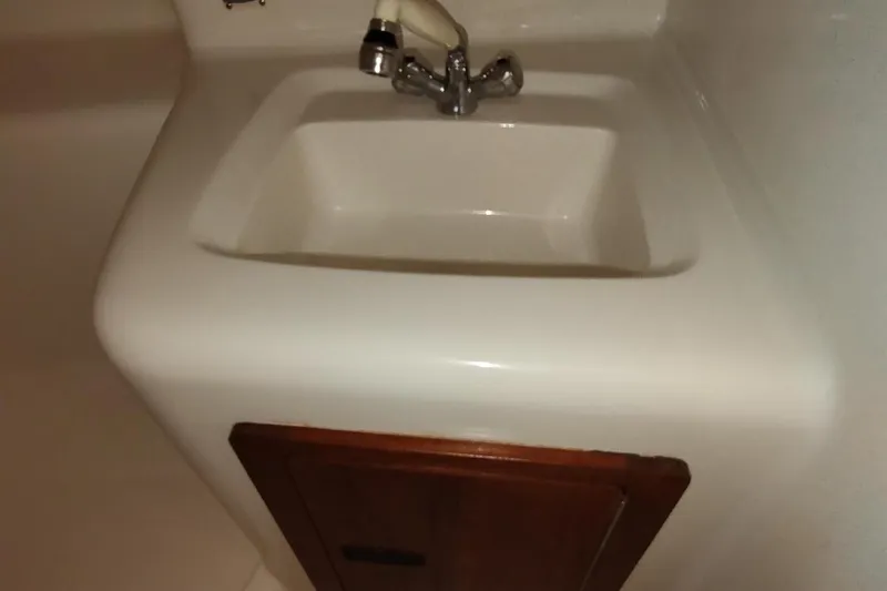 Never Enough Yacht Photos Pics White sink with chrome faucet on Out Island SeaTek 36 Express, 2017 model.