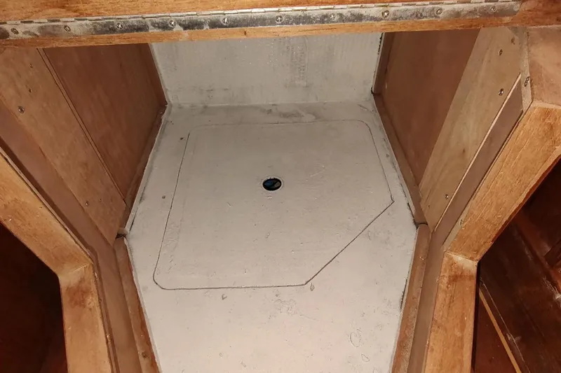 Never Enough Yacht Photos Pics 2017 Out Island SeaTek 36 Express interior compartment with wooden finish.