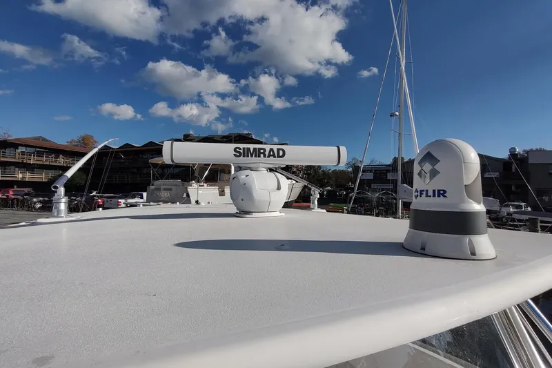 Never Enough Yacht Photos Pics 2017 Out Island SeaTek 36 Express boat with Simrad and FLIR equipment on deck.