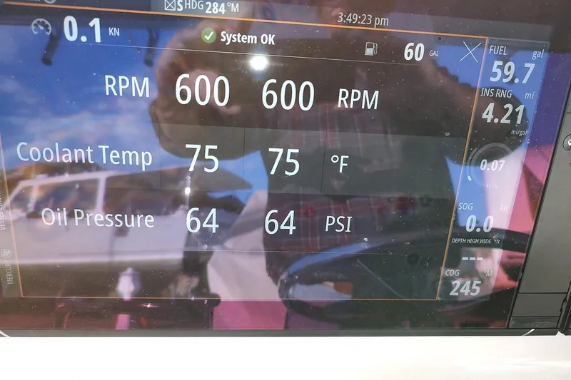 Never Enough Yacht Photos Pics Display panel of 2017 Out Island SeaTek 36 Express showing RPM, coolant temperature, and oil pressure.