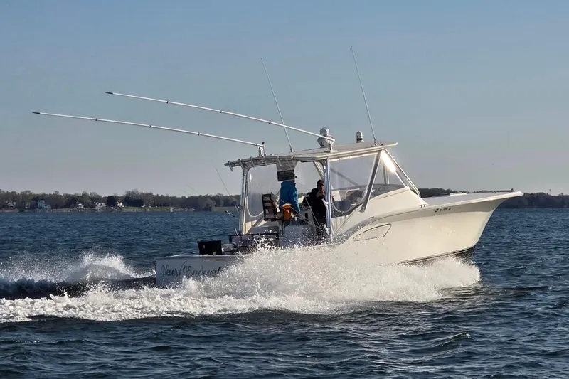 Never Enough Yacht Photos Pics 2017 Out Island SeaTek 36 Express cruising on open water.