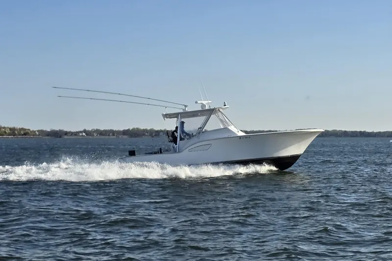 Never Enough Yacht Photos Pics 2017 Out Island SeaTek 36 Express cruising on open water.
