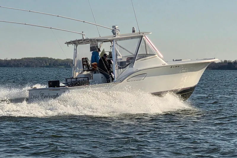 Never Enough Yacht Photos Pics 2017 Out Island SeaTek 36 Express cruising on open water.
