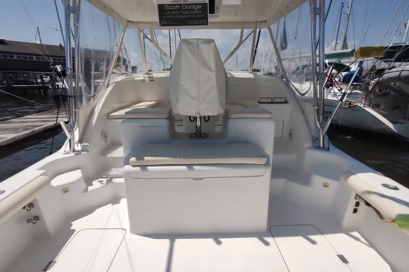 Never Enough Yacht Photos Pics 2017 Out Island SeaTek 36 Express boat interior with seating and covered helm.