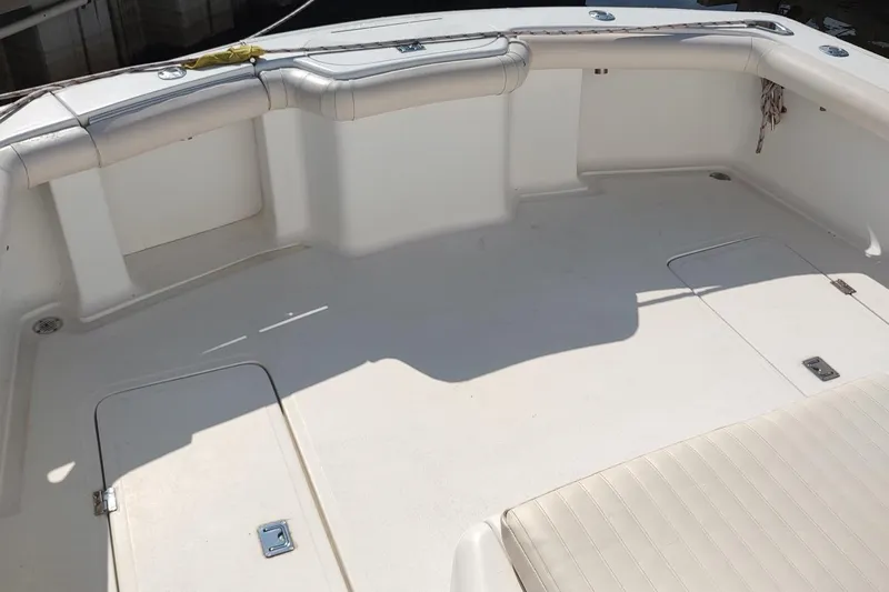 Never Enough Yacht Photos Pics 2017 Out Island SeaTek 36 Express boat deck with cushioned seating and storage compartments.