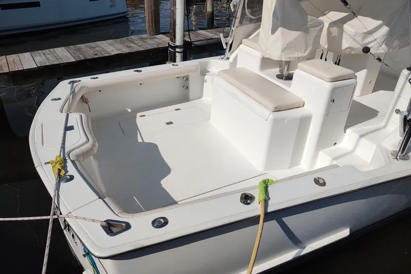 Never Enough Yacht Photos Pics 2017 Out Island SeaTek 36 Express boat interior with seating, docked at marina.