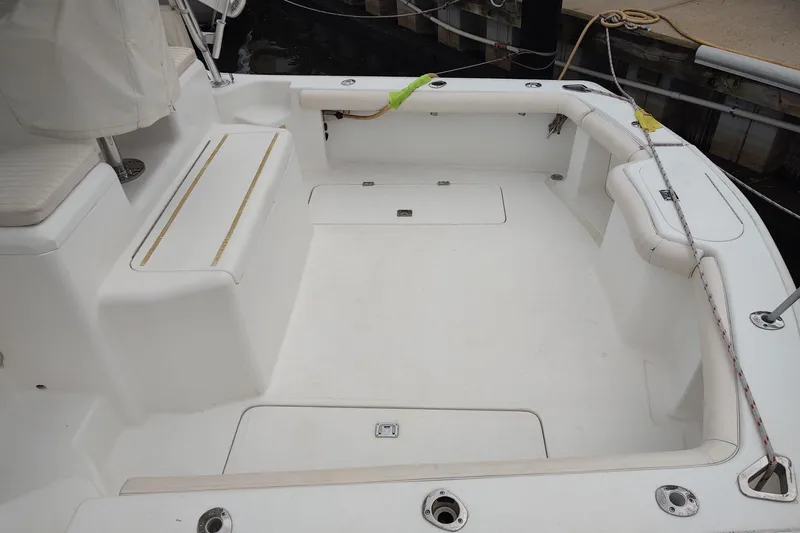 Never Enough Yacht Photos Pics 2017 Out Island SeaTek 36 Express boat deck, featuring spacious seating and storage areas.