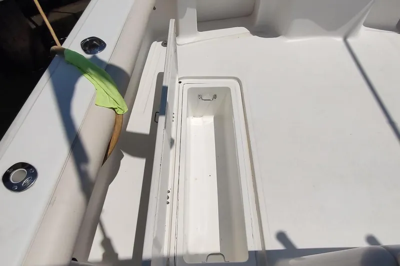 Never Enough Yacht Photos Pics 2017 Out Island SeaTek 36 Express boat deck with open storage compartment.