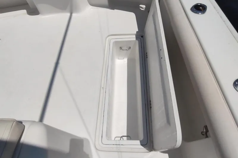 Never Enough Yacht Photos Pics Open storage compartment on 2017 Out Island SeaTek 36 Express boat deck.