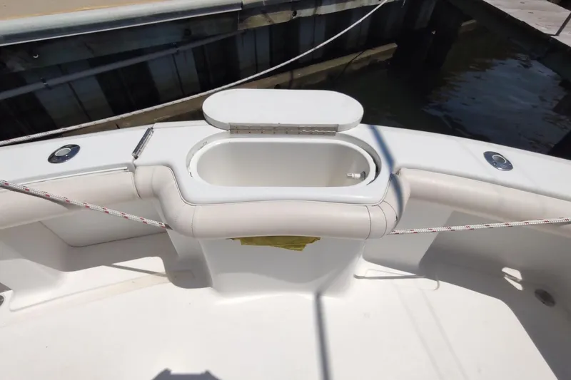 Never Enough Yacht Photos Pics 2017 Out Island SeaTek 36 Express boat with open storage compartment at dock.