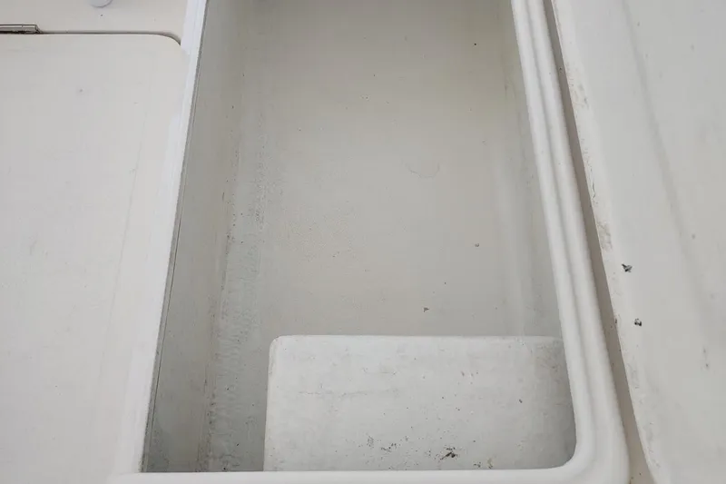 Never Enough Yacht Photos Pics Storage compartment on 2017 Out Island SeaTek 36 Express boat, empty and clean.