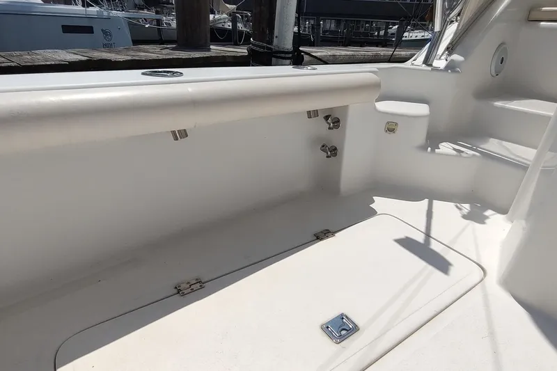 Never Enough Yacht Photos Pics 2017 Out Island SeaTek 36 Express boat interior with storage and seating.