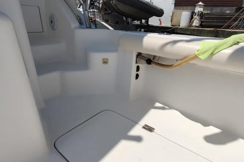Never Enough Yacht Photos Pics 2017 Out Island SeaTek 36 Express boat interior with clean white surfaces and docked equipment.