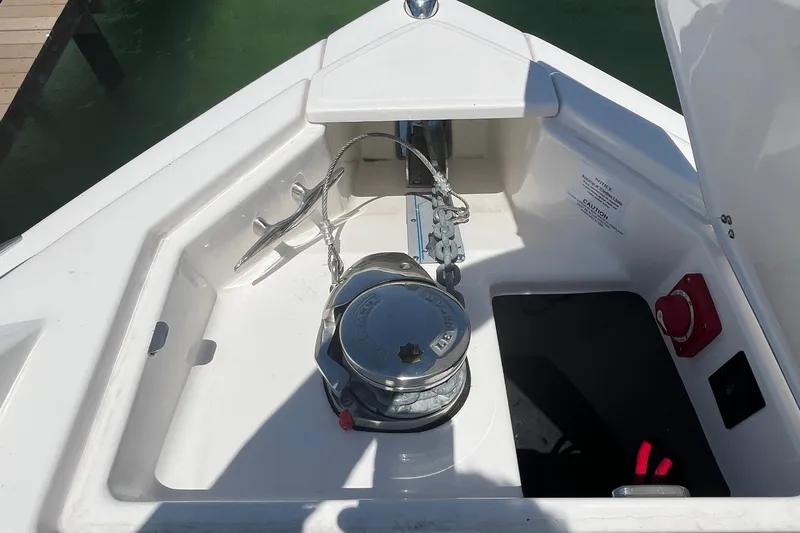  Yacht Photos Pics 2024 Regal 33 SAV boat anchor compartment with winch and chain.