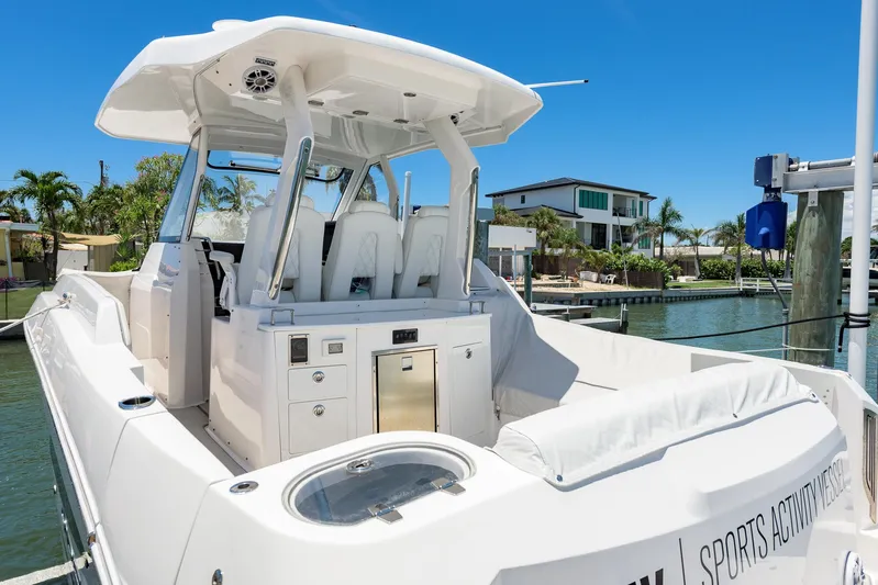  Yacht Photos Pics 2024 Regal 33 SAV boat docked, featuring sleek design and modern amenities.