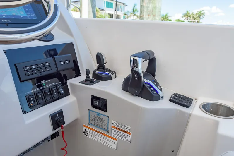  Yacht Photos Pics Control panel of 2024 Regal 33 SAV boat with throttle and joystick.