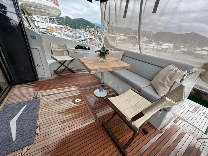  Yacht Photos Pics Luxurious 2011 Azimut 43S yacht deck with seating, table, and scenic marina view.