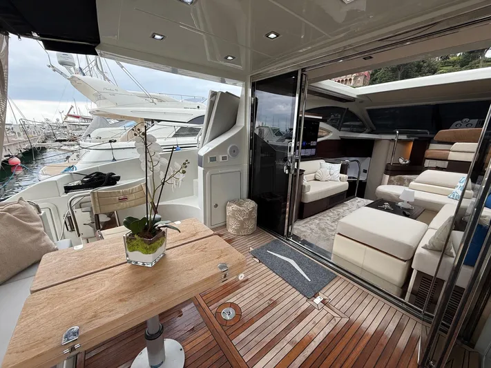  Yacht Photos Pics Luxurious 2011 Azimut 43S yacht interior with elegant seating and wooden deck.