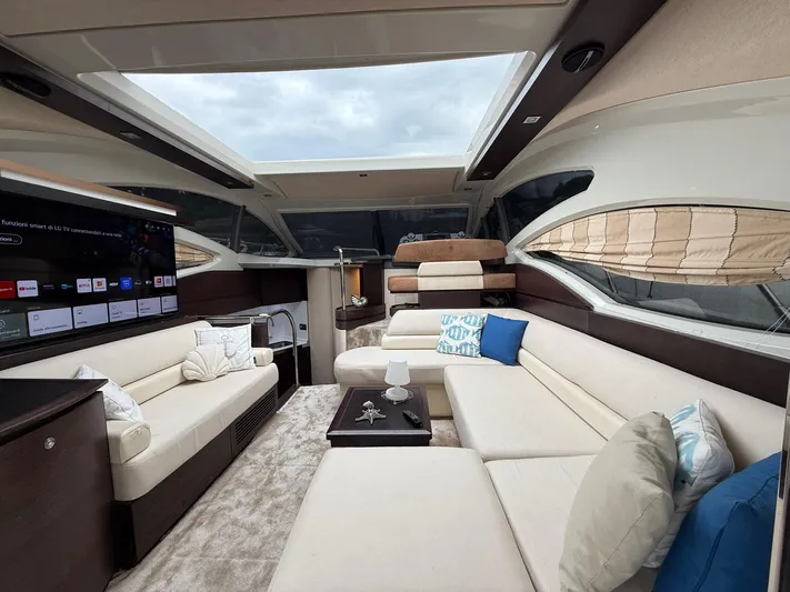  Yacht Photos Pics Luxurious interior of 2011 Azimut 43S yacht with plush seating and modern entertainment system.