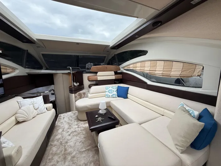  Yacht Photos Pics Luxurious interior of 2011 Azimut 43S yacht with plush seating and elegant decor.
