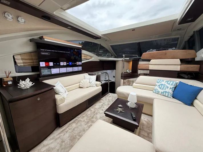  Yacht Photos Pics Luxurious interior of a 2011 Azimut 43S yacht with plush seating and modern amenities.