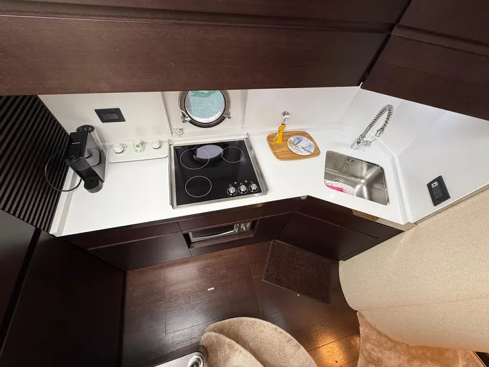  Yacht Photos Pics Modern kitchen in 2011 Azimut 43S yacht with stove, sink, and espresso machine.