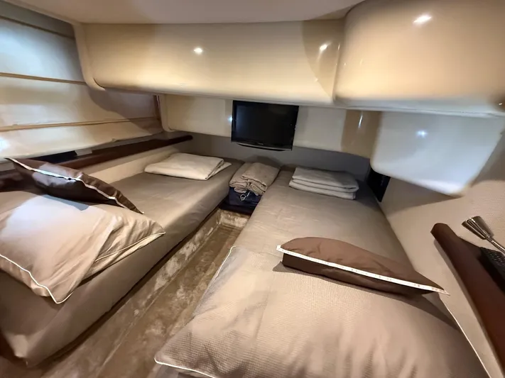  Yacht Photos Pics Luxurious cabin interior of 2011 Azimut 43S yacht with twin beds and modern decor.