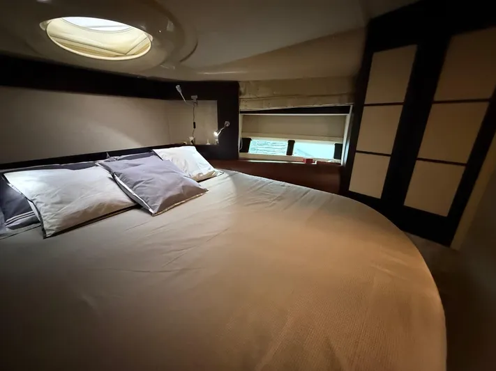  Yacht Photos Pics Luxurious bedroom interior of 2011 Azimut 43S yacht with elegant bedding and ambient lighting.