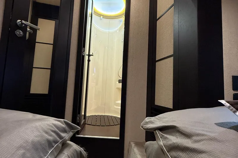  Yacht Photos Pics Interior of 2011 Azimut 43S yacht, featuring a modern bathroom and cozy bedroom.