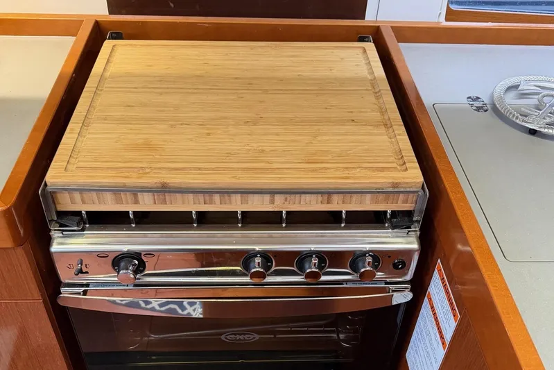 Allure Yacht Photos Pics Stove and custom cutting board.