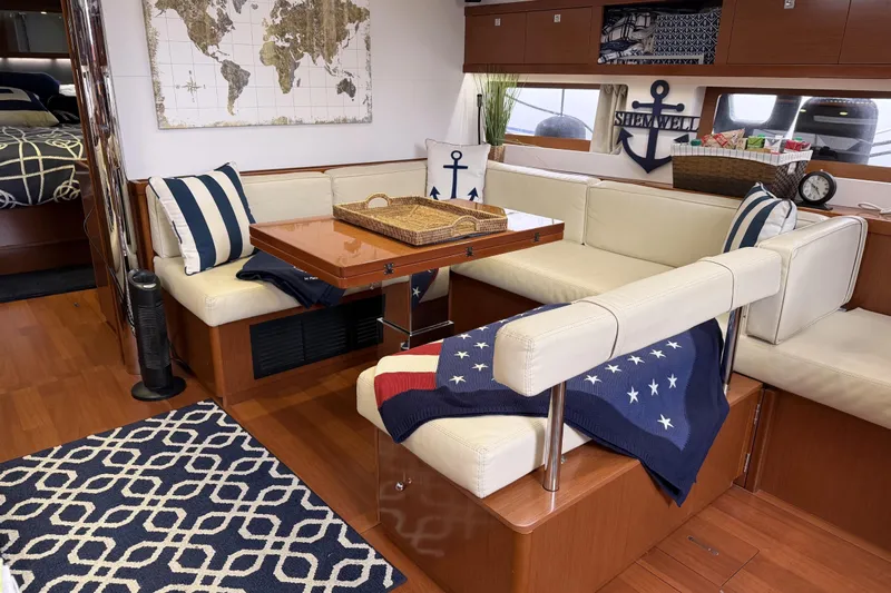Allure Yacht Photos Pics Salon (Starboard) U Shaped Seating, Dining Area with Hi-Lo Table.