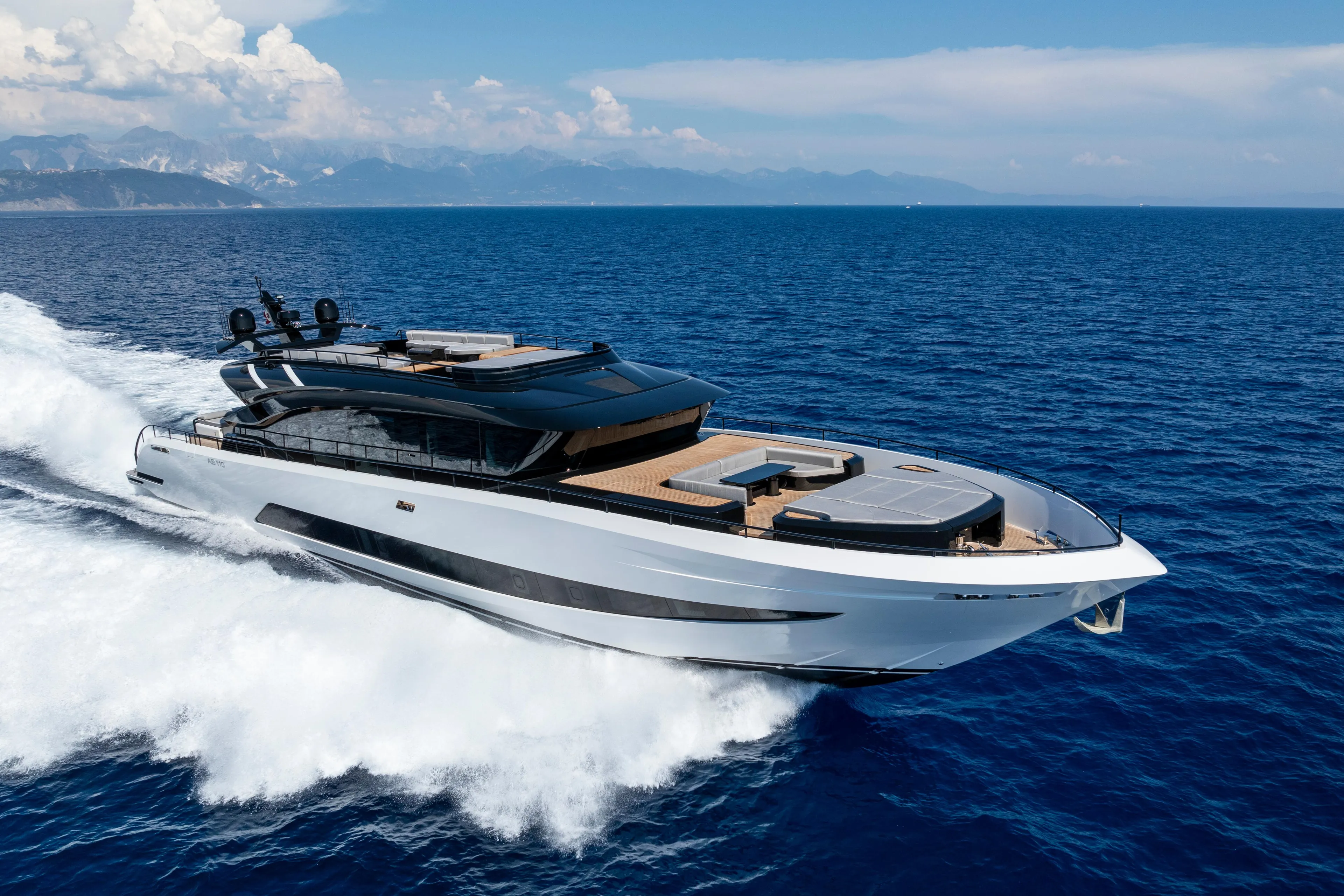 Luxurious 2026 AB 110 yacht cruising on open sea under clear skies.