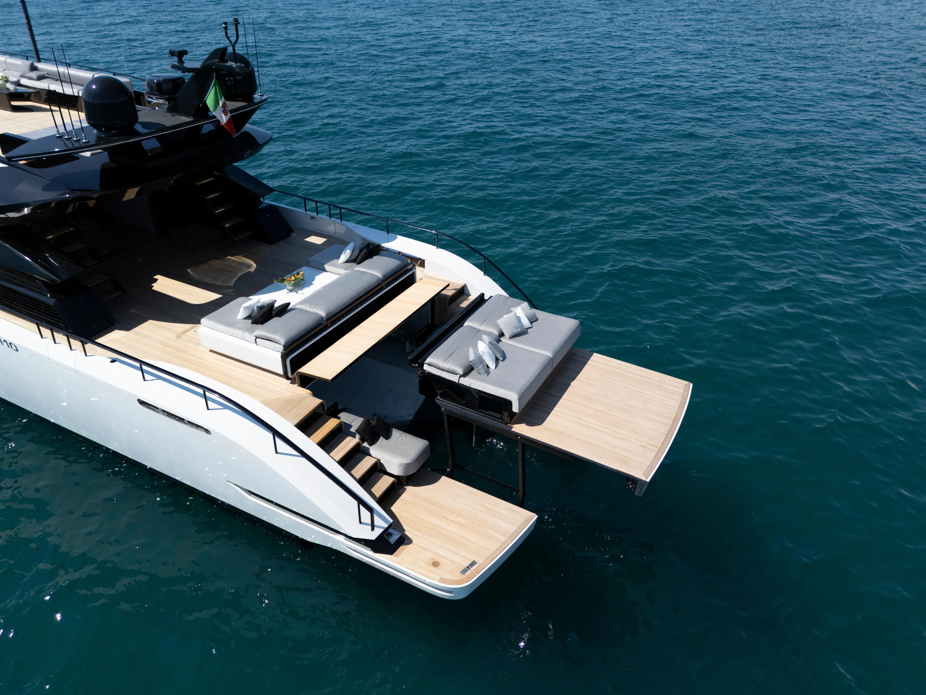 Luxurious 2026 AB 110 yacht with spacious deck and elegant seating on calm blue waters.