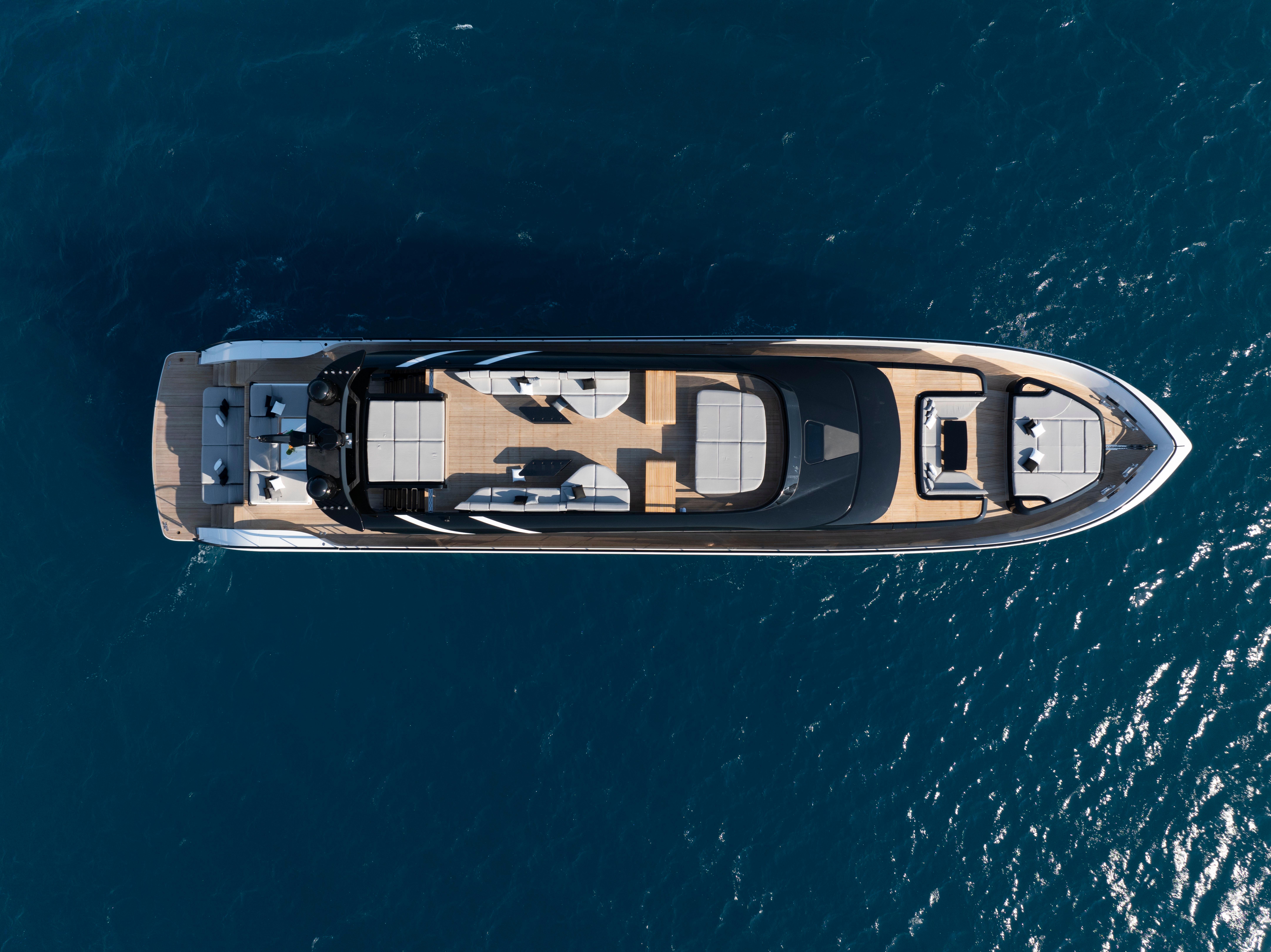 Aerial view of 2026 AB 110 yacht on blue ocean water.