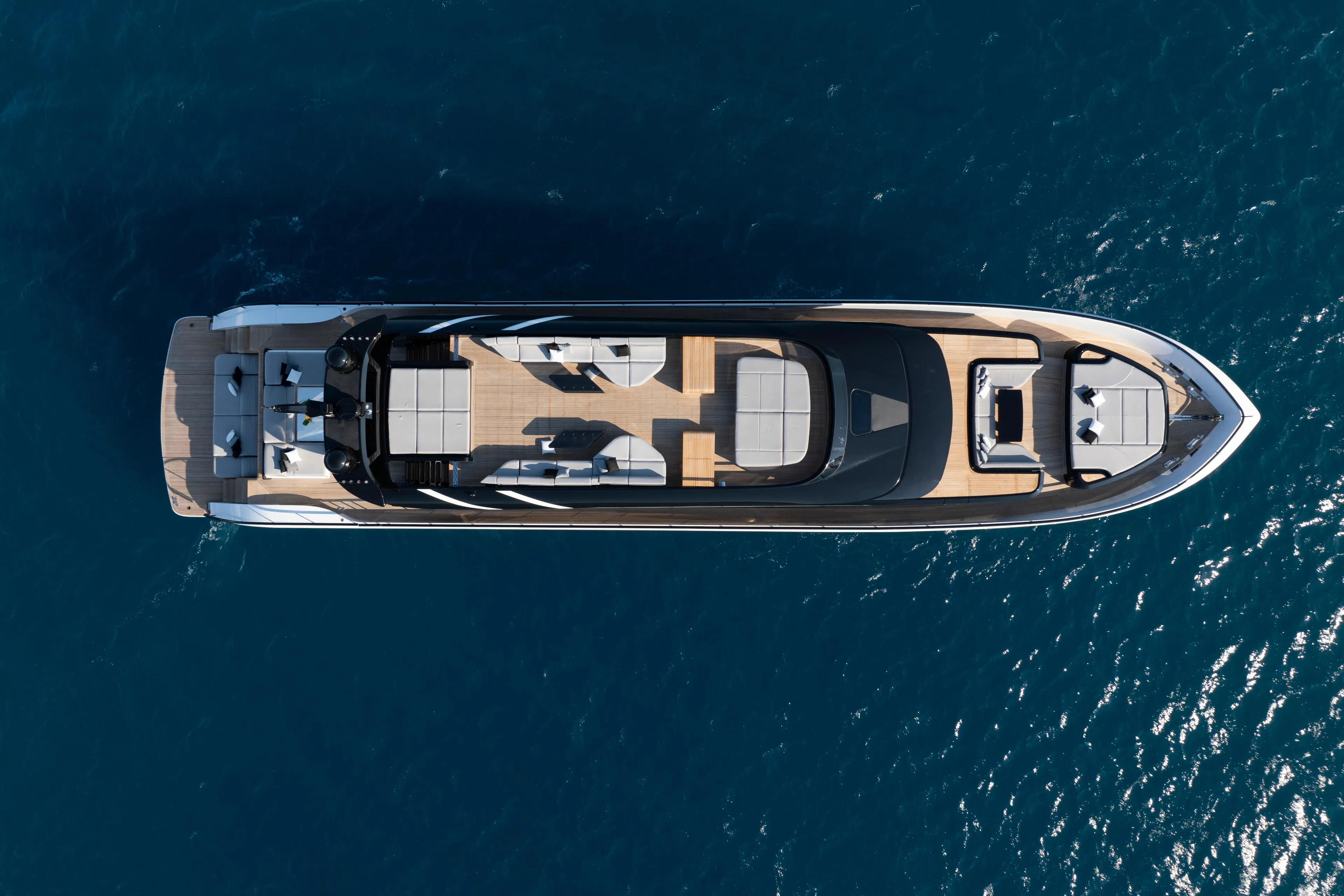 Aerial view of 2026 AB 110 yacht on blue ocean water.