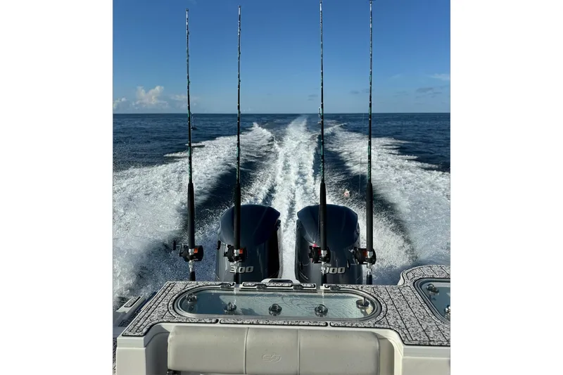  Yacht Photos Pics Sea Fox 288 Commander 2021 boat with fishing rods and dual engines on open water.