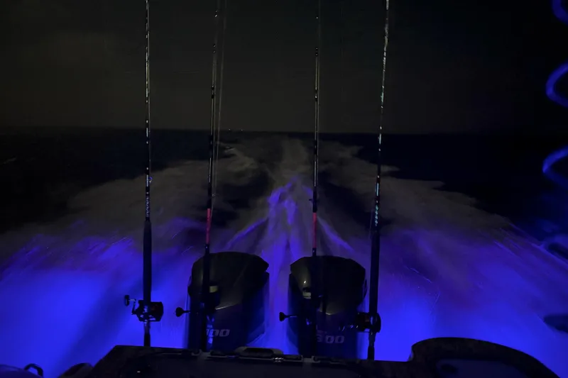  Yacht Photos Pics Night view of 2021 Sea Fox 288 Commander with illuminated wake and fishing rods.