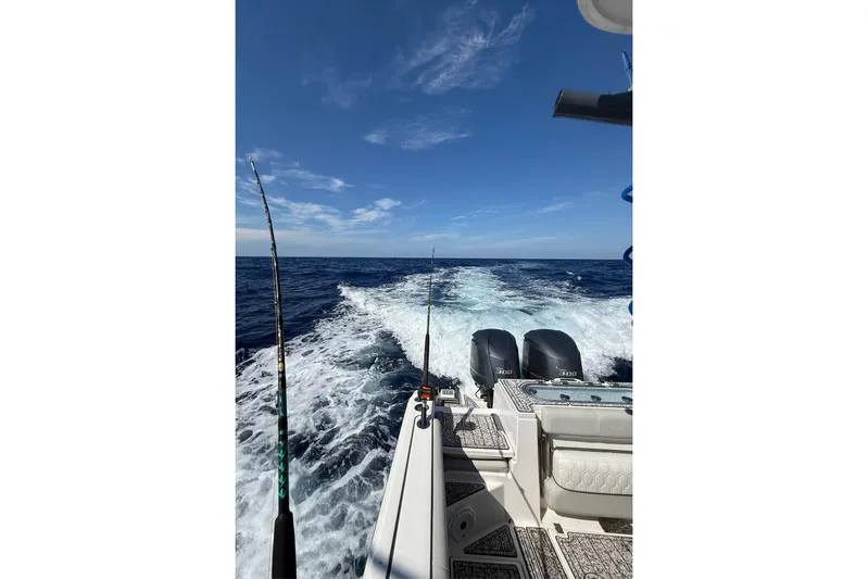  Yacht Photos Pics Sea Fox 288 Commander 2021 cruising on open ocean with fishing rods.