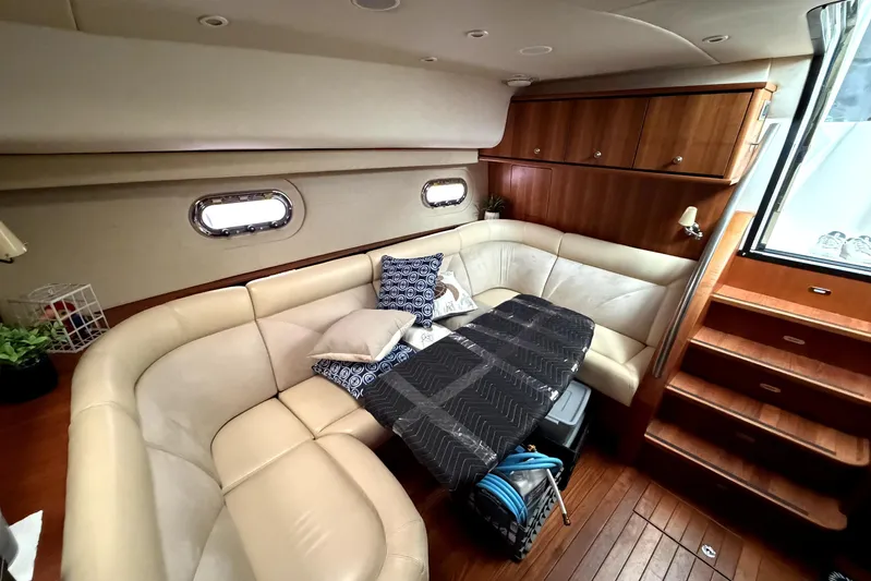  Yacht Photos Pics Luxurious interior of 2006 Tiara Yachts 4300 Sovran with plush seating and elegant wood finishes.