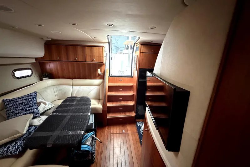  Yacht Photos Pics Luxurious interior of 2006 Tiara Yachts 4300 Sovran with elegant wood finishes and cozy seating.