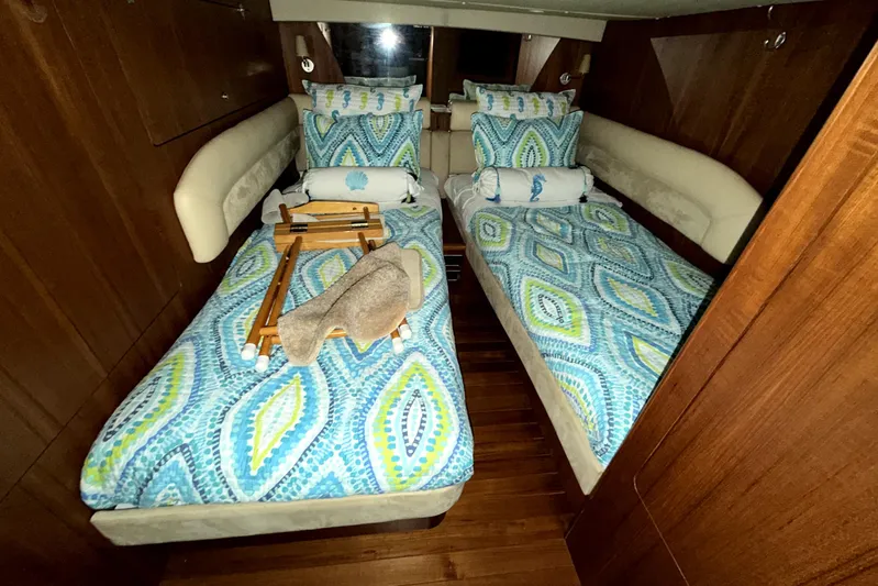 Yacht Photos Pics Luxurious 2006 Tiara Yachts 4300 Sovran cabin with twin beds and vibrant bedding.